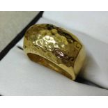 A heavy 925 silver, yellow gold plated ring with beaten metal effect, size P