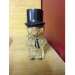 A 1930's glass wallflower character scent bottle.