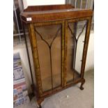 A walnut bow fronted display cabinet with 2 shelves. 126x77x32cm.