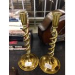 A pair of vintage brass twisted stem candlesticks.