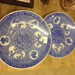 A pair of early 20th century blue & white bat printed Japanese Arita chargers.