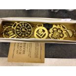 Collection of 9 horse brasses including Winston Churchill plus a vintage book 'All about Horse