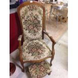 A reproduction Louis XVI style armchair with flower pattern tapestry upholstery and matching