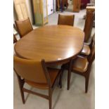 A c1970s G-plan extending dining room table & 6 chairs.