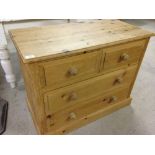 A pine 2 over 2 chest of drawers. 90cm wide and 71cm tall.