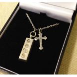 A silver ingot with Sheffield 1979 hallmark and cross on a silver chain, total weight approx 12.5g.