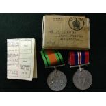 2 World War II medals,: 1 Defence Medal & 1 1939-45 War Medal in delivery box - name T. Robinson,