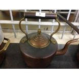 A vintage copper kettle.