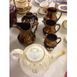 7 pieces of late 19th century Staffordshire to include matching graduated jugs.