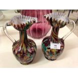 A pair of antique Victorian glass multi coloured ewers.