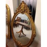 Large gilt oval mirror. 150 x 104cm.