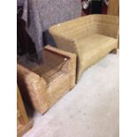 Woven seagrass 2 seater sofa together with a matching coffee table with seagrass base and glass top