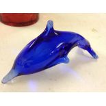 A Bristol blue glass dolphin paperweight.