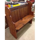 A pitch pine 2 seater settle. 102cm wide.