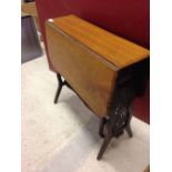 Small oak gateleg table with carved wood sides.