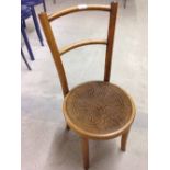Wooden chair with circular seat.
