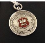 Sterling silver 1929-30 Norwich & District Football League medal. Red enamelled shield.