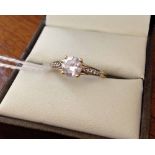 Ladies 9ct gold ring set with 0.75ct Cubic Zirconia and Cubic Zirconia shoulders. Size O.