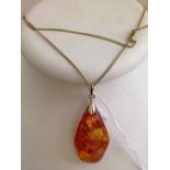 Amber pendant approx 5cm long on 24 inch chain.