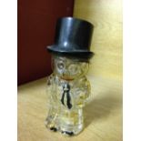 A 1930's glass wallflower character scent bottle.