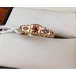 Antique 9ct gold ring with central garnet and 2 seed pearls. Size O.