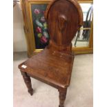 Small oak chair with shield shape back.