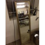 A gilt framed rectangular mirror 120 x 36cm