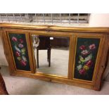 Large gilt framed mirror with oil painted flower panels. 85 x 140cm.