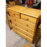 A pine 2 over 4 chest of drawers