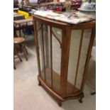 Vintage bow fronted display cabinet with glass shelves. Crack to one panel of side glass