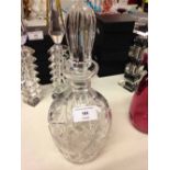 A cut crystal decanter.