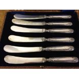 Boxed set of hallmarked 1912 silver butter knives.