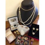 A box containing mostly costume jewellery earrings including a Jon Richard earring and necklace set,