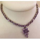 925 Silver necklace with pendant, set with 39 oval lilac stones possibly pale amethysts. Length