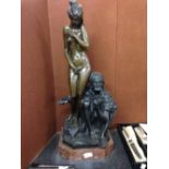 A large Arab & naked slave girl bronze on marble base. 70cm tall.