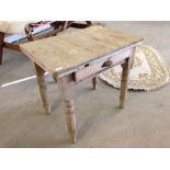 A small pine kitchen table with drawer to long side.