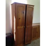 A 2 door pine wardrobe.