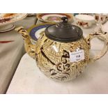 A 19th Century Staffordshire pottery wood grain effect teapot with pewter lid