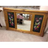 Large gilt framed mirror with oil painted flower panels. 85 x 140cm.