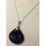 Blue & green polished stone pendant on a silver chain.