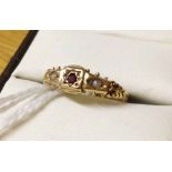 Antique 9ct gold ring with central garnet and 2 seed pearls. Size O.