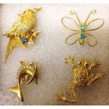 4 yellow metal animal brooches: butterfly, frog, dolphin & bird.