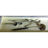 6 assorted silver spoons to include a pair of salt spoons and a sauce ladle with ebony twisted