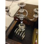A plated 3 sconce candelabra with a toast rack.