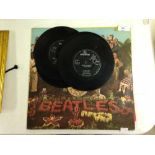 7 Beatles single records and a Sgt. Peppers LP