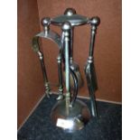 An original Art Deco fireside companion set in chrome, 'S' shaped, maker Ianthe