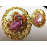 2 oval brooches of different sizes with french scenes of courting couples.