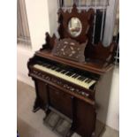 A Victorian bellows organ by William James Ltd