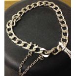 Heavy white metal (possibly continental silver) flat curb link bracelet with safety chain, approx