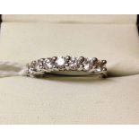 9ct white gold ladies half eternity ring set with 7 Cubic Zirconias. Size K½.